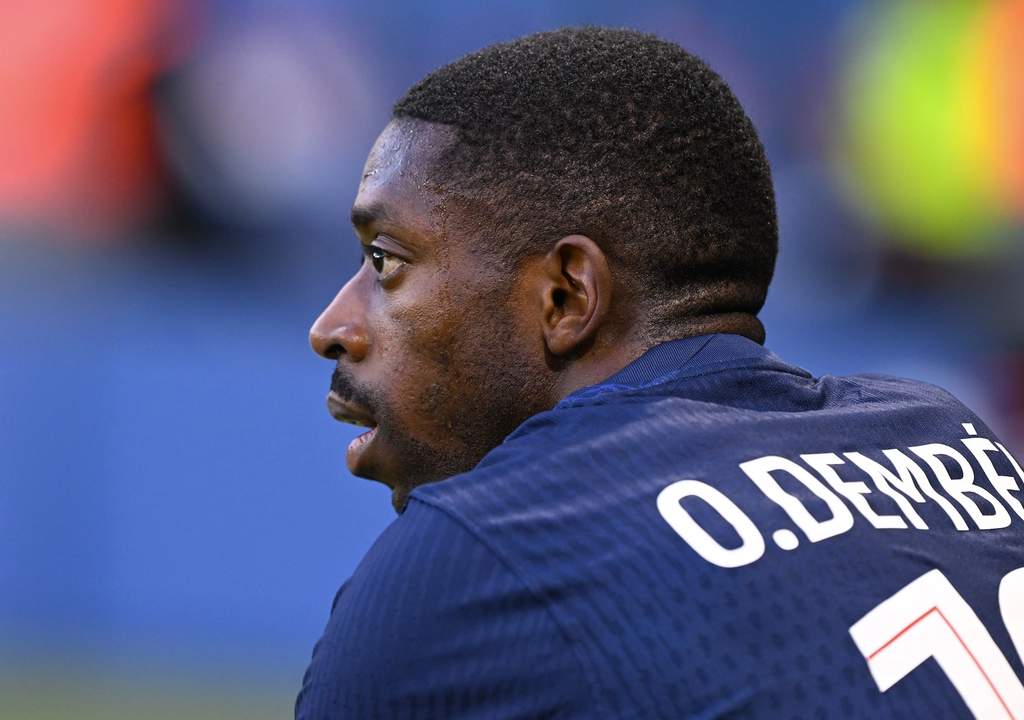 Arsenal defender Willian Saliba and PSG forward Ousmane Dembélé in European football action